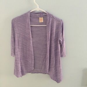 A size 7/8 children’s cardigan, in lavender.